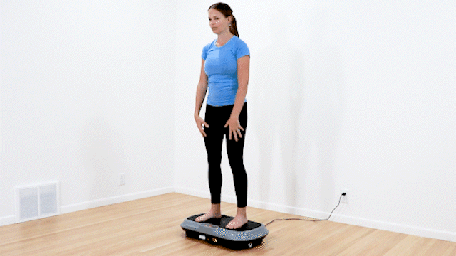 Fourth vibration plate for lymphatic drainage exercise. Physical therapist doing a modified deadlift.