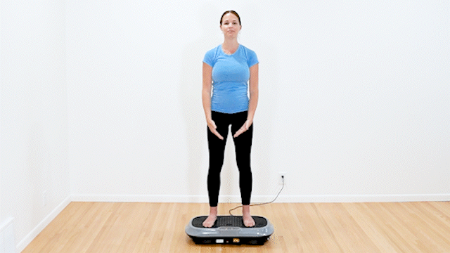 Second vibration plate for lymphatic drainage exercise. Physical therapist doing arm raises.