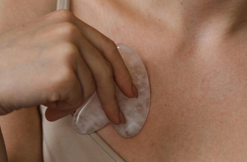 Woman doing lymphatic drainage massage.
