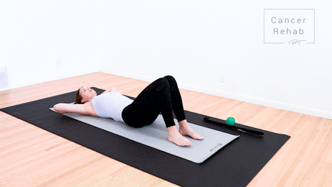 animated clip of physical therapist lying on a yoga mat, hands behind head, knees bent up and letting knees fall out to the left side