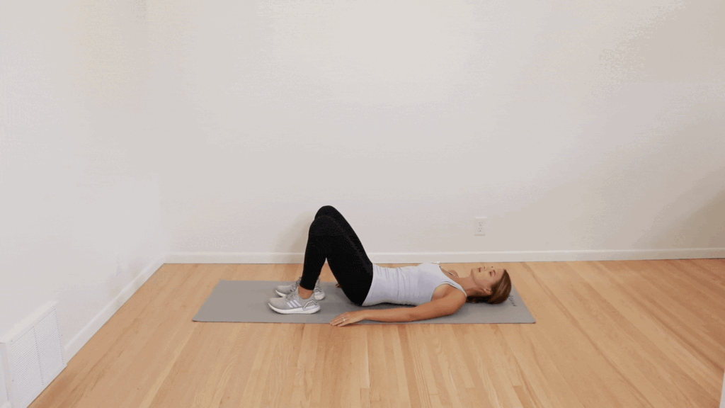 Laying bridge exercise shown by physical therapist
