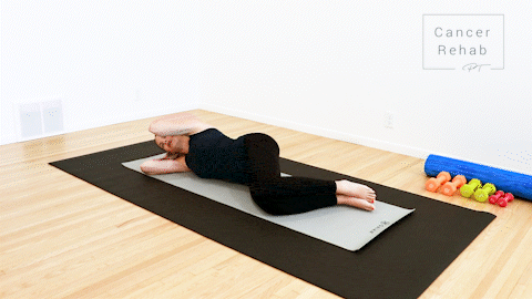 animated clip of physical therapist lying on a yoga mat, on here side, with hands behind head, rotating left elbow open and behind for a chest stretch