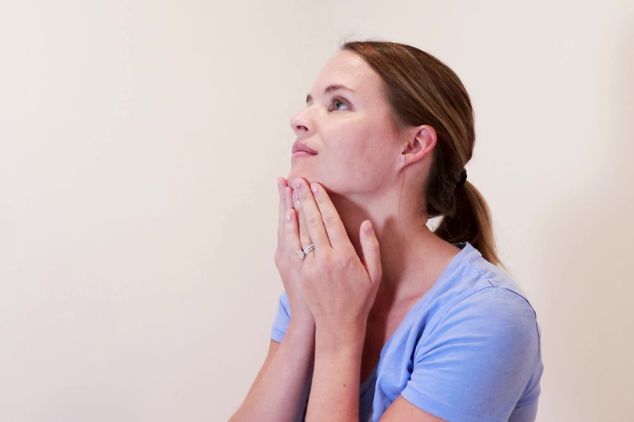 Massaging your face. 