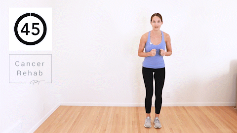 A woman shuffling to the side and then jumping in the air.