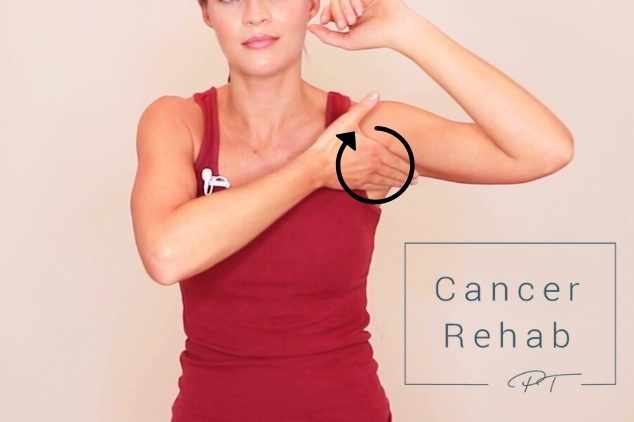 A certified lymphedema therapist massaging the lymph nodes in her armpit as part of a full body lymphatic drainage massage.