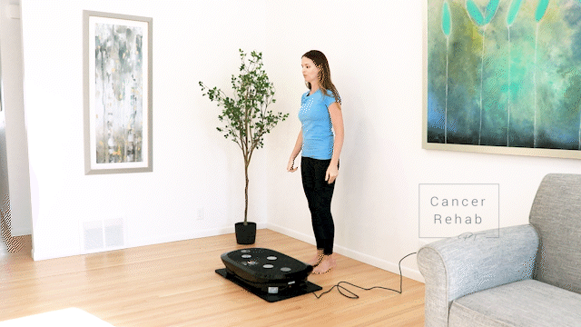 Vibration plate calf stretch exercise.